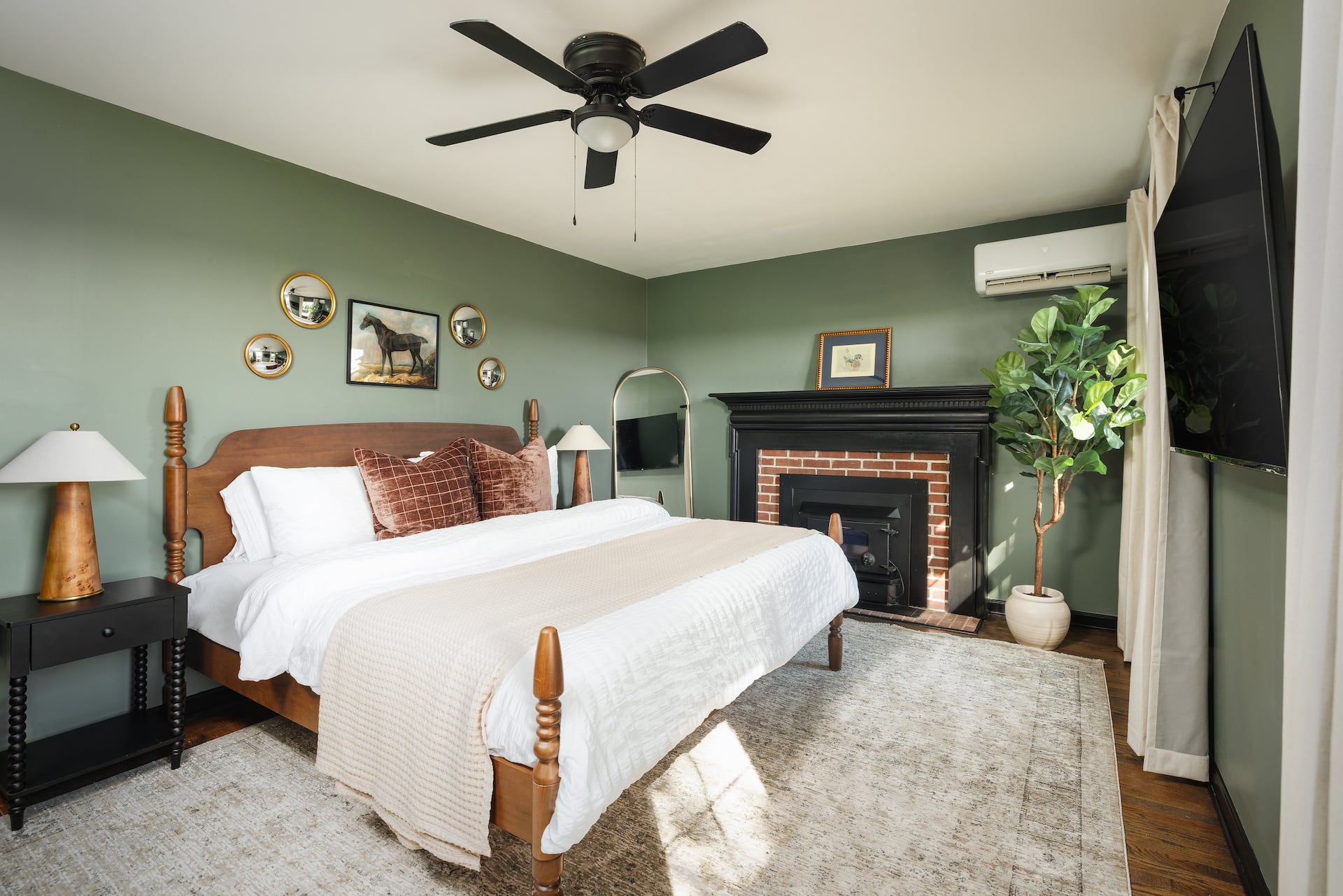 Bright king bedroom with fireplace