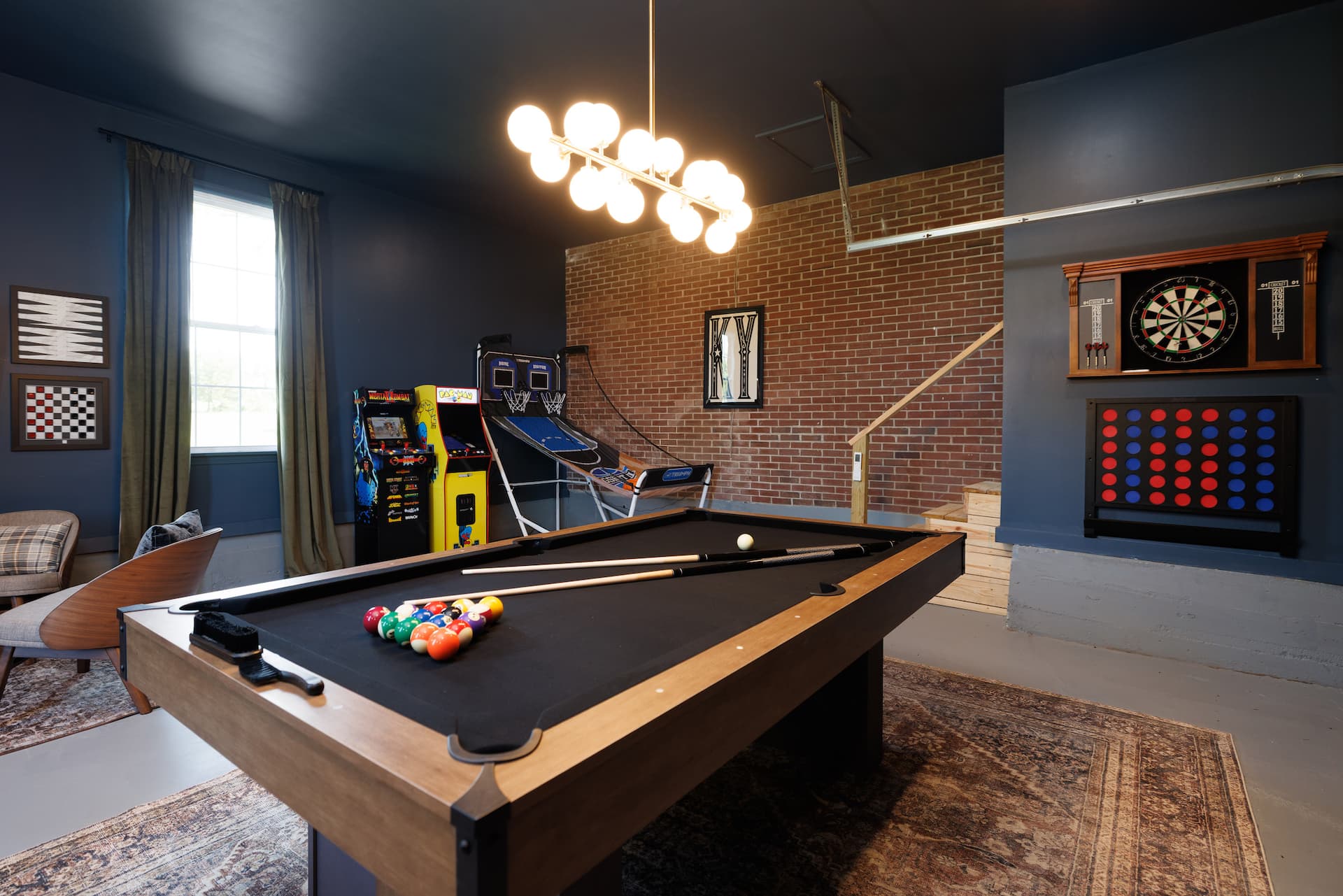 Game room with pool table and arcade games